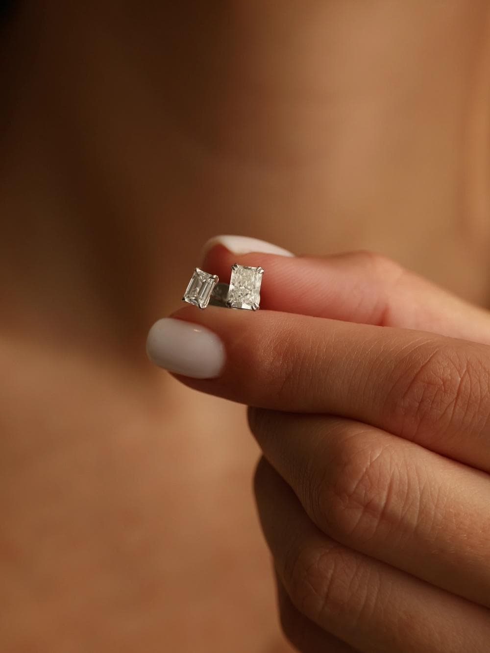 Emerald Cut Stud Earrings finger detail view