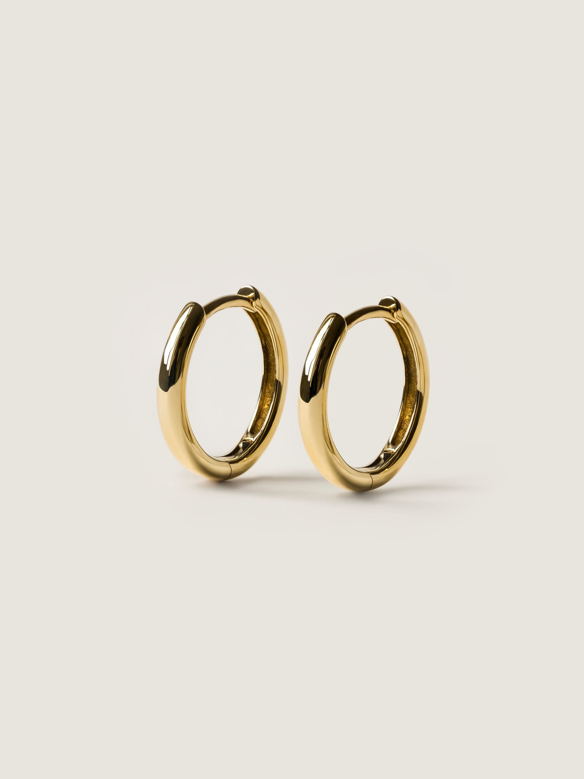Huggie Hoop Earrings in yellow gold
