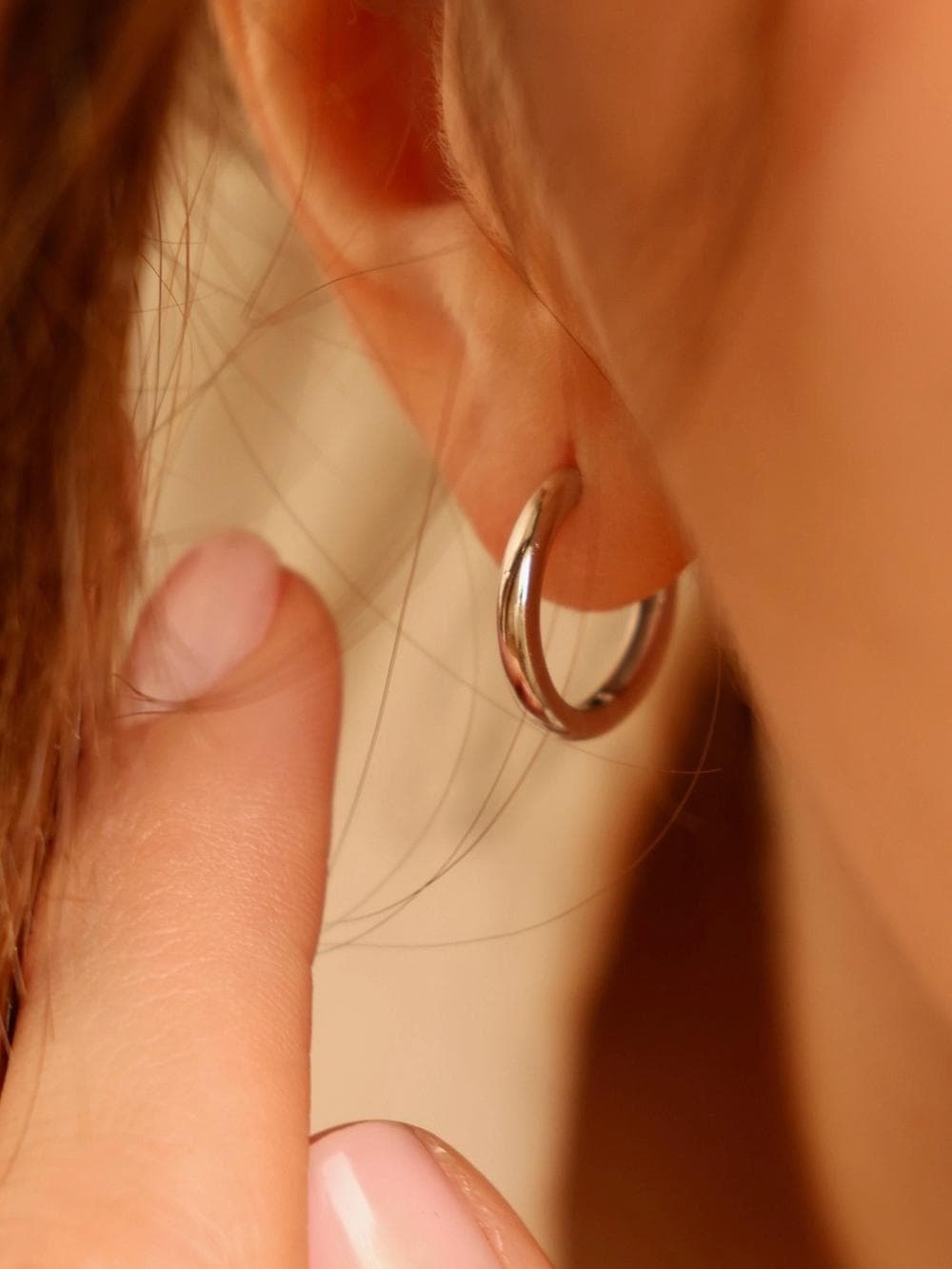 Huggie Hoop Earrings ear detail