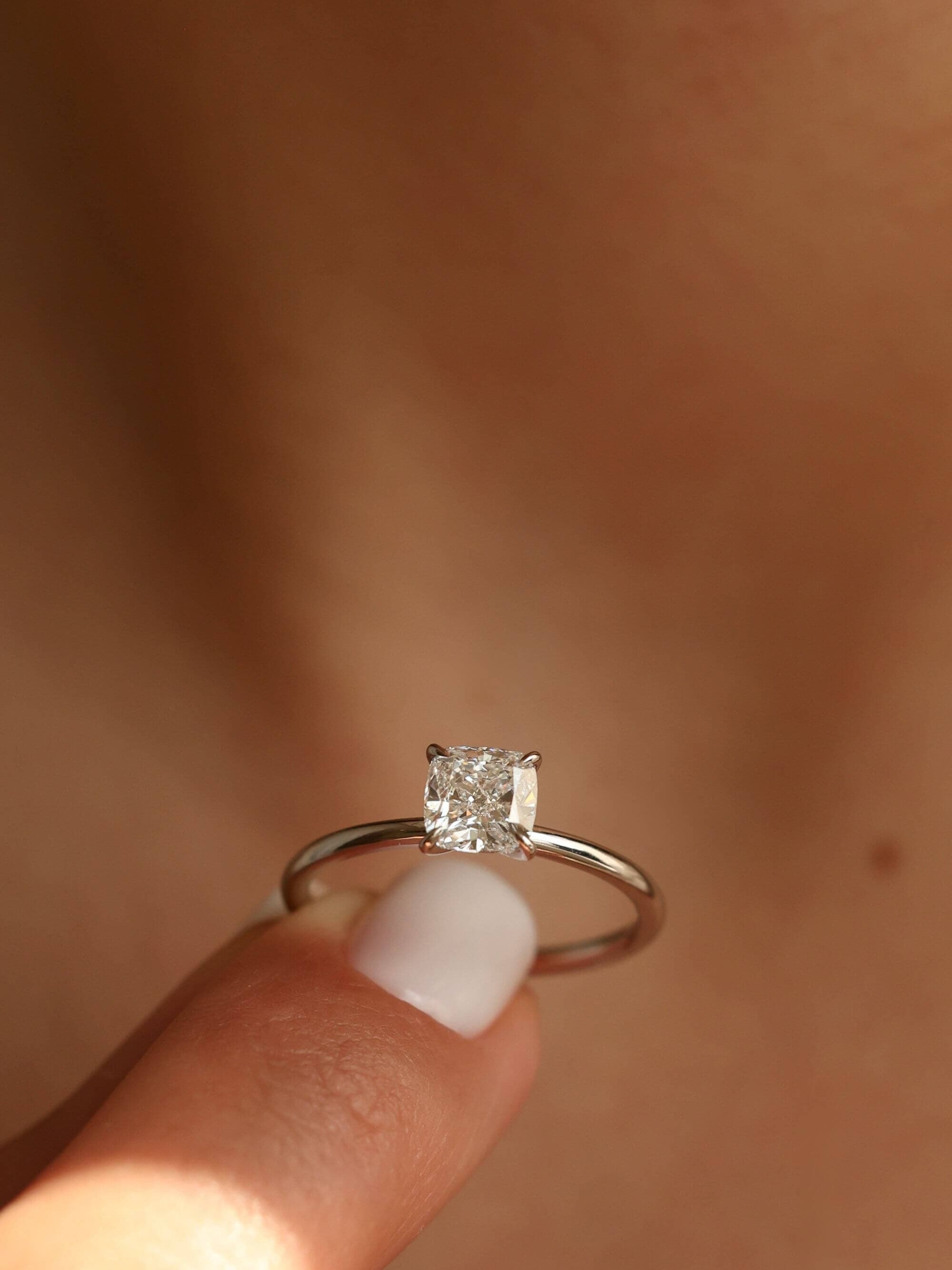 Classic Cushion Cut Ring on finger in white gold