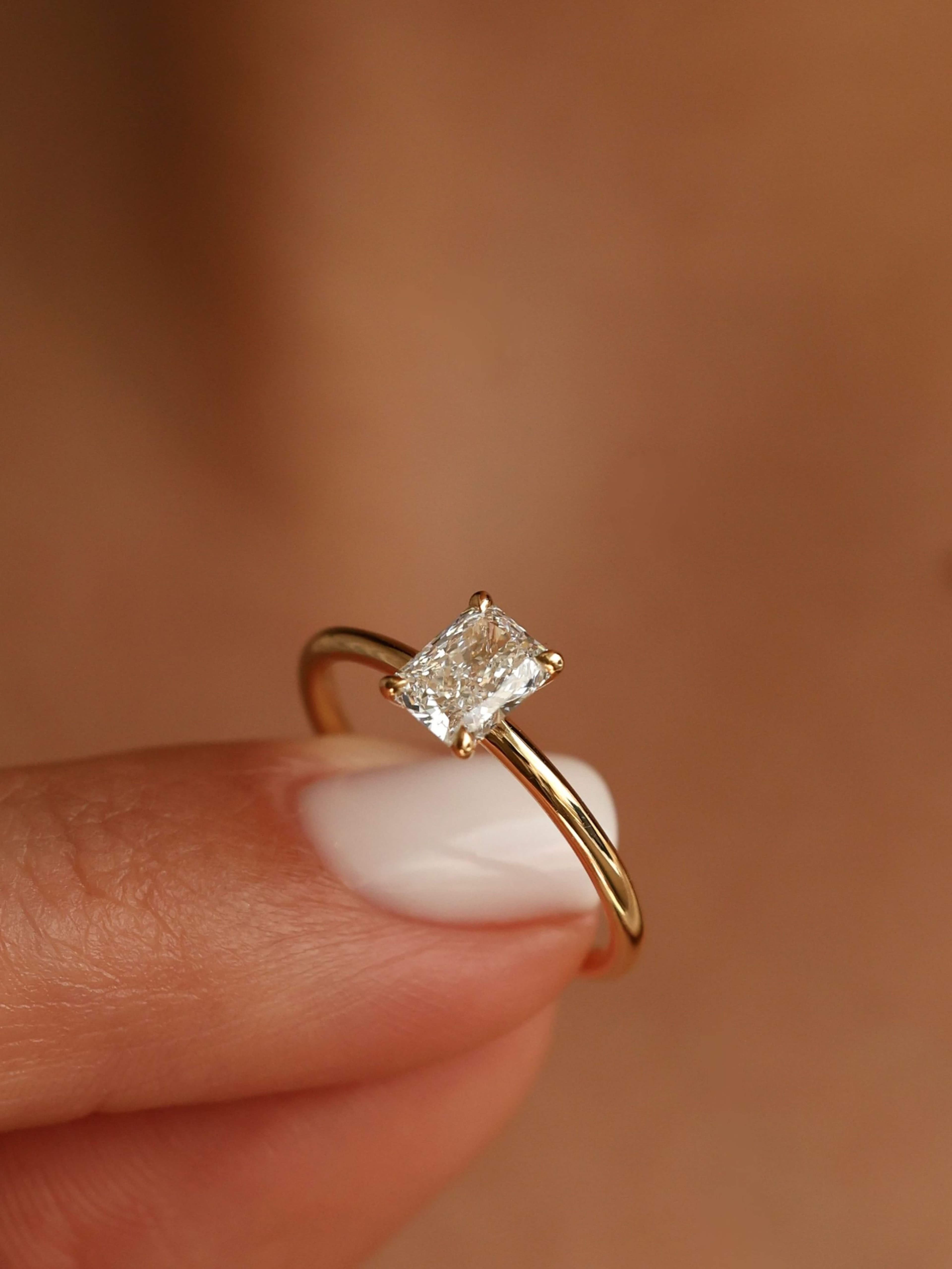 Classic Emerald Cut Ring on finger