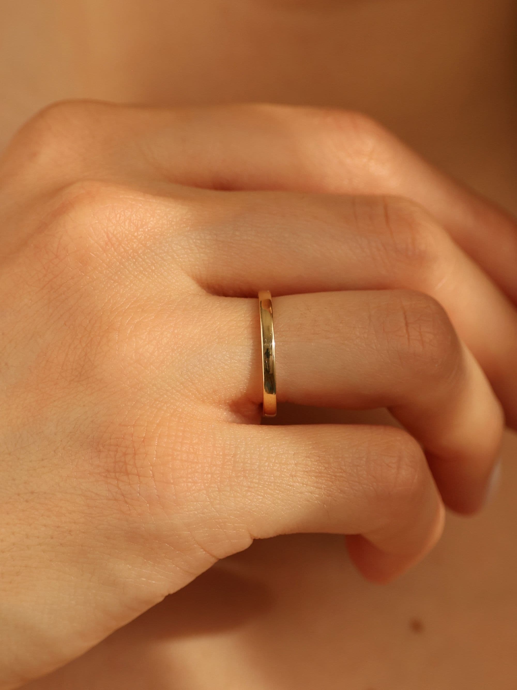 Classic 2 mm wedding band on hand