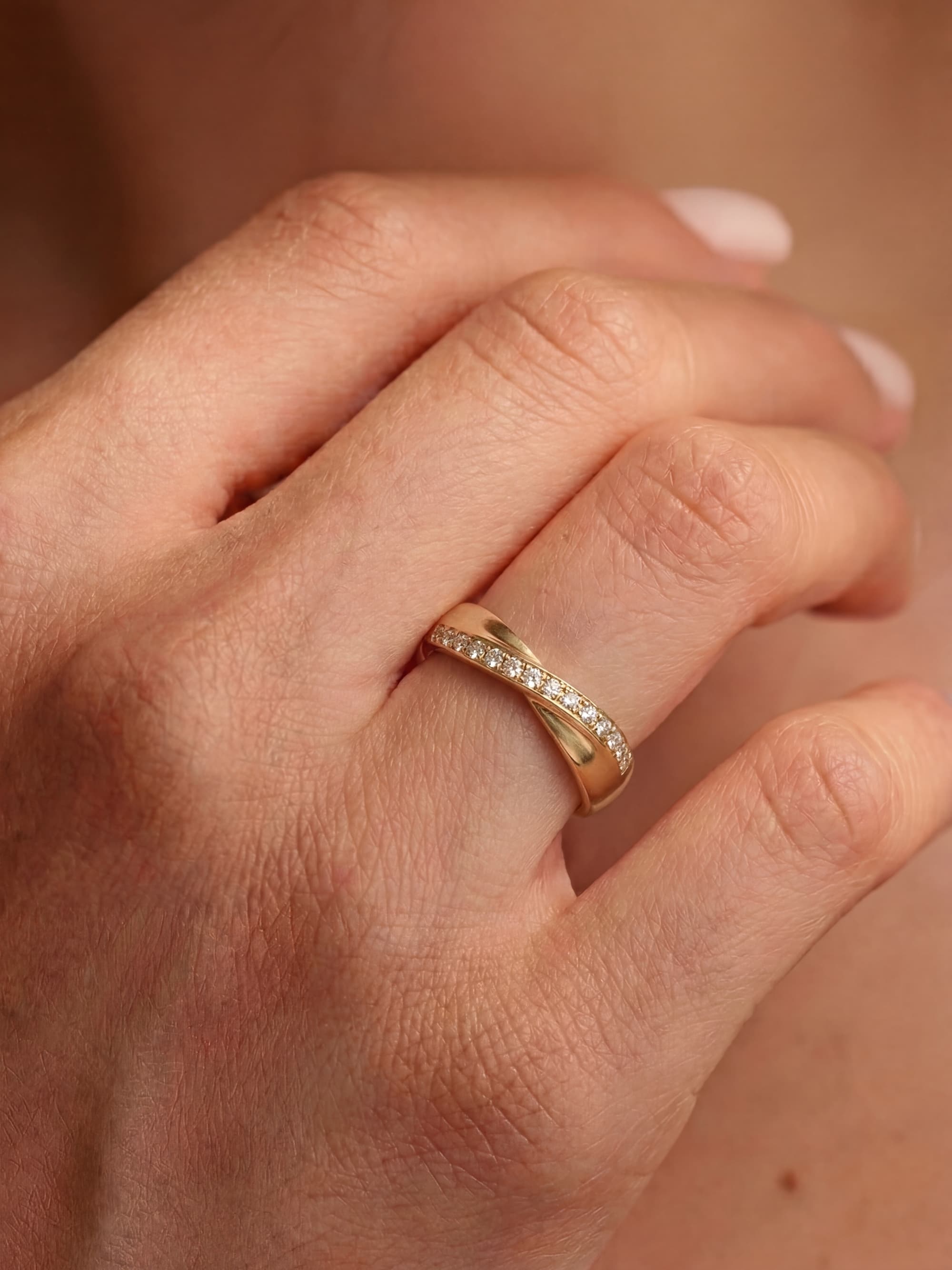 Stellar Union wedding ring with diamonds on hand